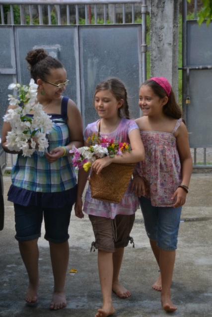 girls bringing bday flwrs2